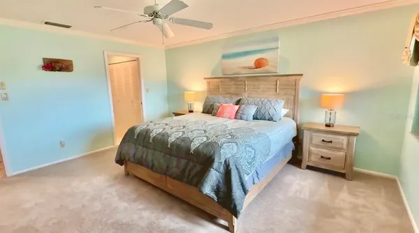 a large bathroom with a glass shower door and a sink