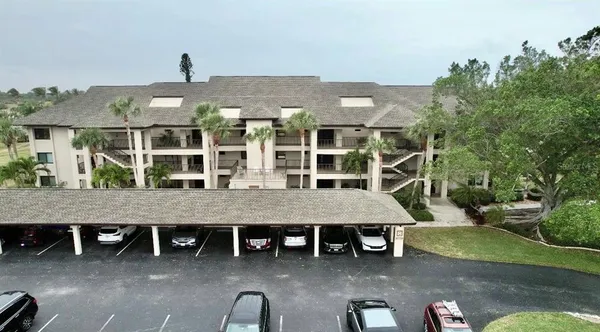 an aerial view of a house with a porch