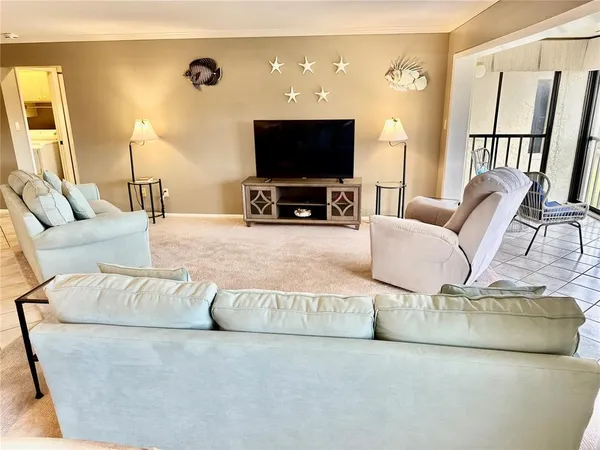 a kitchen with stainless steel appliances a stove a sink refrigerator and a microwave