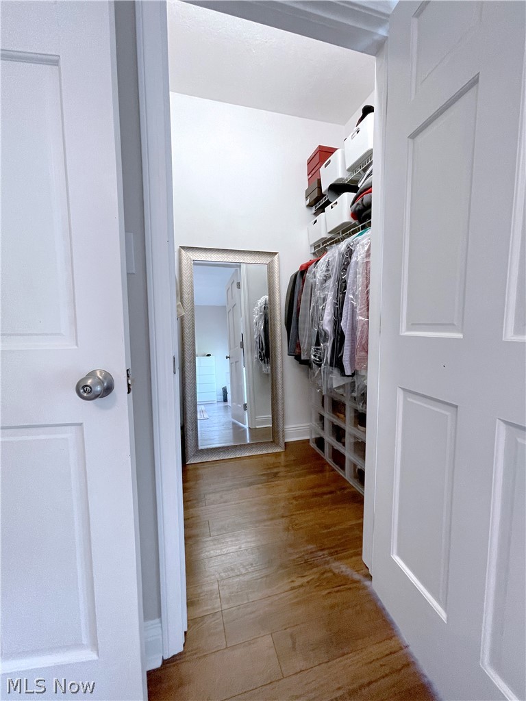 718 Sunridge Road Fairlawn, OH 44333 - Photo 17 of 49 Spacious second master closet featuring dark wood-type flooring