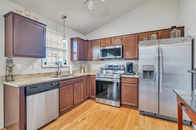 a kitchen with a table and chairs in it