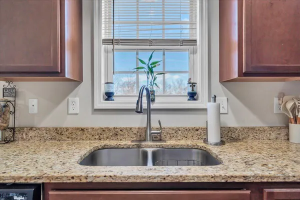 a kitchen with stainless steel appliances a refrigerator stove and sink