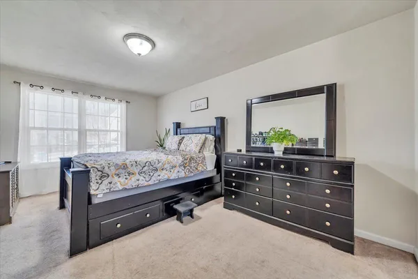 a kitchen with stainless steel appliances granite countertop a refrigerator a sink dishwasher a stove with wooden cabinets and floor