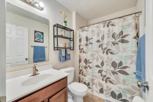 a bedroom with a bed and a chair