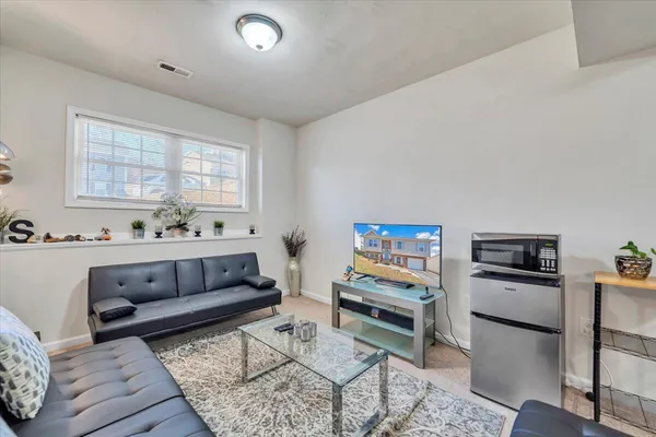 a bedroom with a bed and hallway