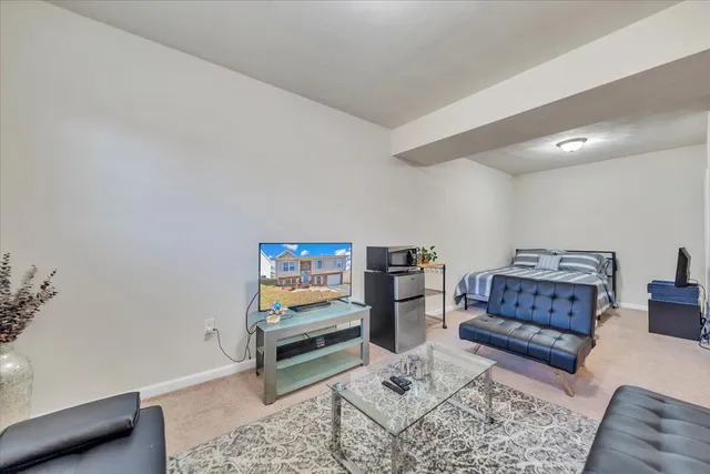 a living room with furniture and window