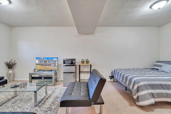 a living room with furniture rug and window