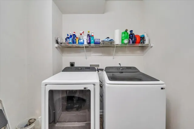 a view of a workspace with furniture and a bookshelf