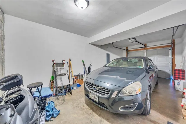 a view of a workspace with furniture and a potted plant
