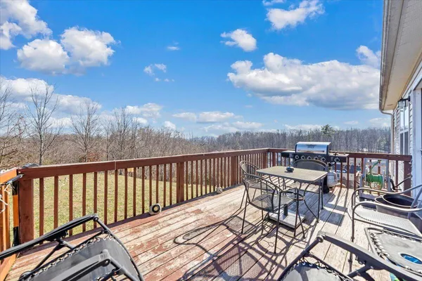 a view of a balcony with furniture