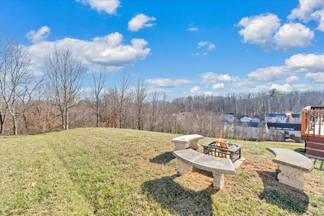 a view of a backyard with sitting area