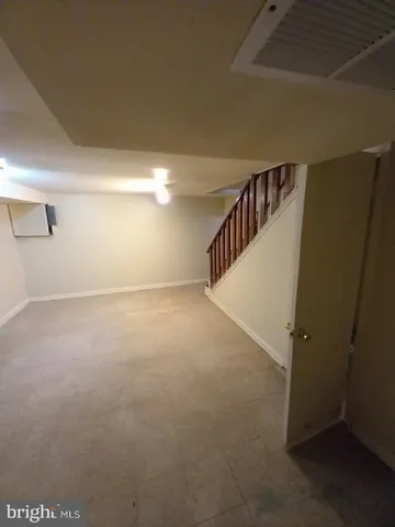 a view of an empty room with stairs