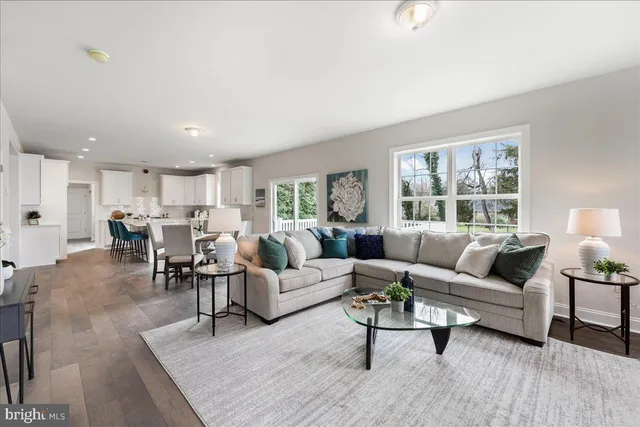 a living room with furniture and a table