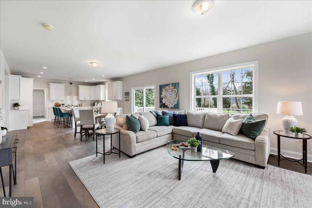 1240 Gradyville Road Glen Mills, PA 19342 - Photo 13 of 39 a living room with furniture and a table