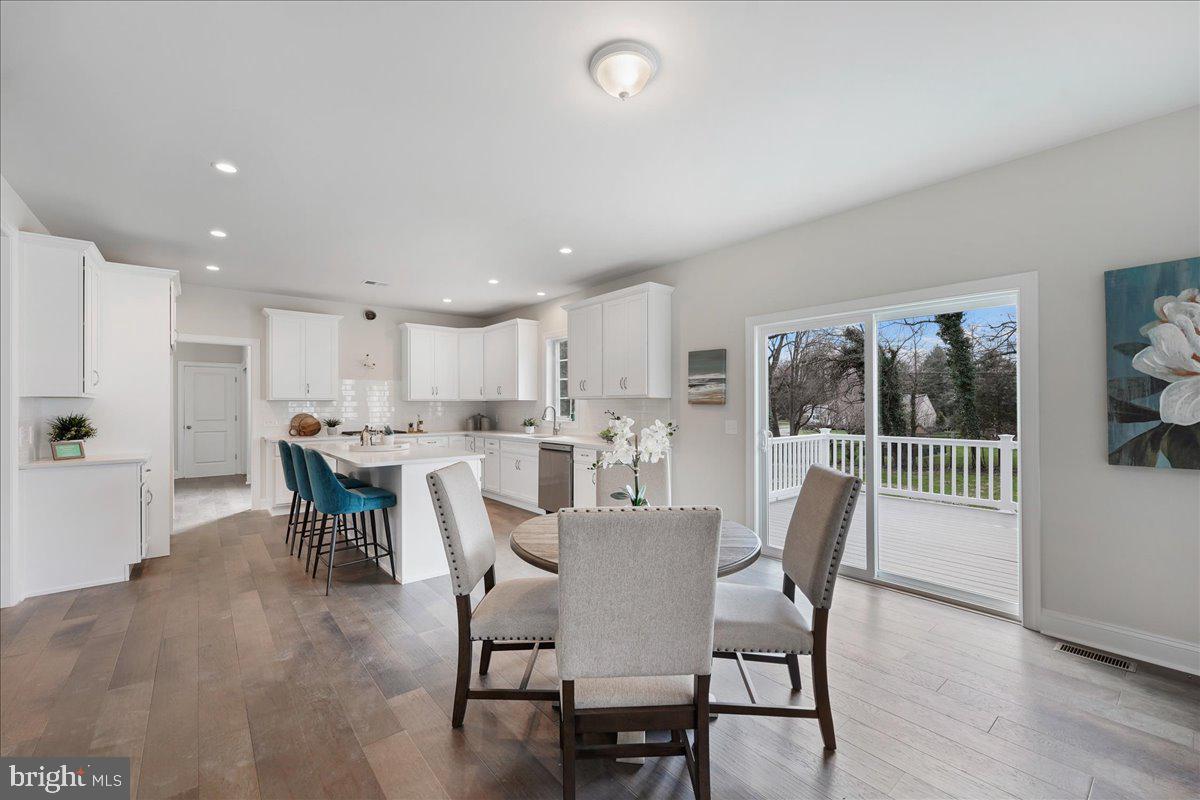 1240 Gradyville Road Glen Mills, PA 19342 - Photo 15 of 39 a dining room with furniture and a floor to ceiling window