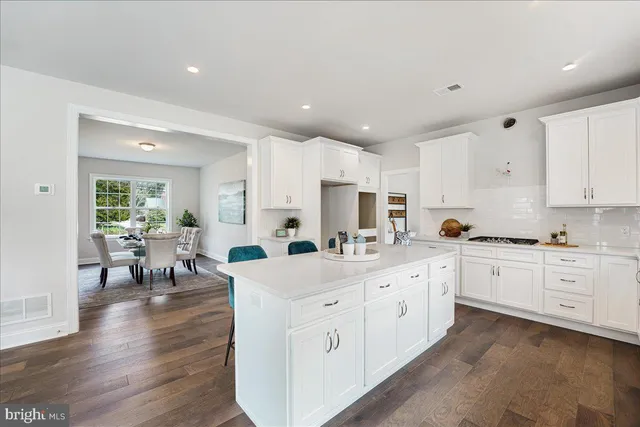 a large white kitchen with lots of white appliances