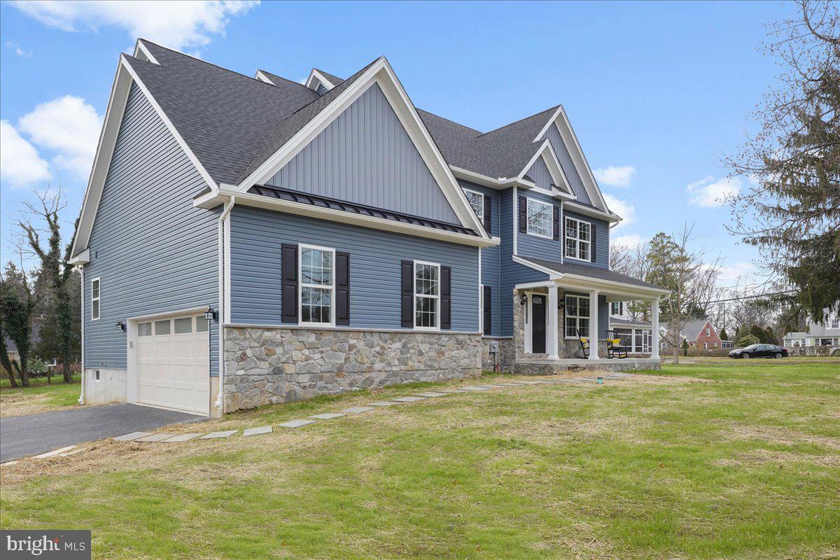 1240 Gradyville Road Glen Mills, PA 19342 - Photo 2 of 39 a front view of a house with a garden