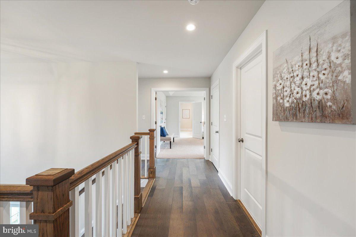 1240 Gradyville Road Glen Mills, PA 19342 - Photo 25 of 39 a view of a hallway with wooden floor and staircase