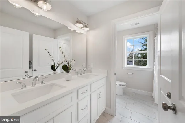 a bathroom with a shower and a window