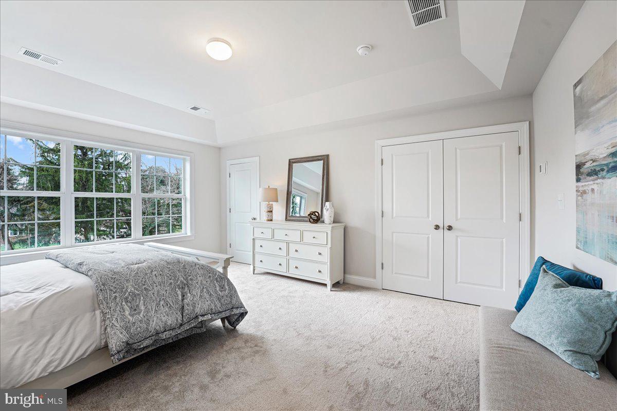 1240 Gradyville Road Glen Mills, PA 19342 - Photo 34 of 39 a spacious bedroom with a bed and a large window