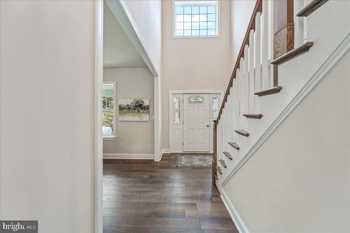 1240 Gradyville Road Glen Mills, PA 19342 - Photo 5 of 39 a view of entryway and hall with wooden floor