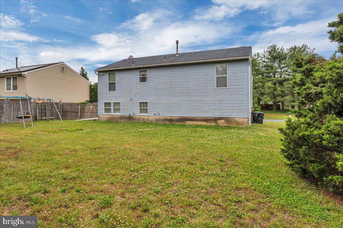 11 Decatur Lane Sicklerville, NJ 08081 - Photo 23 of 24 a backyard of a house with table and chairs