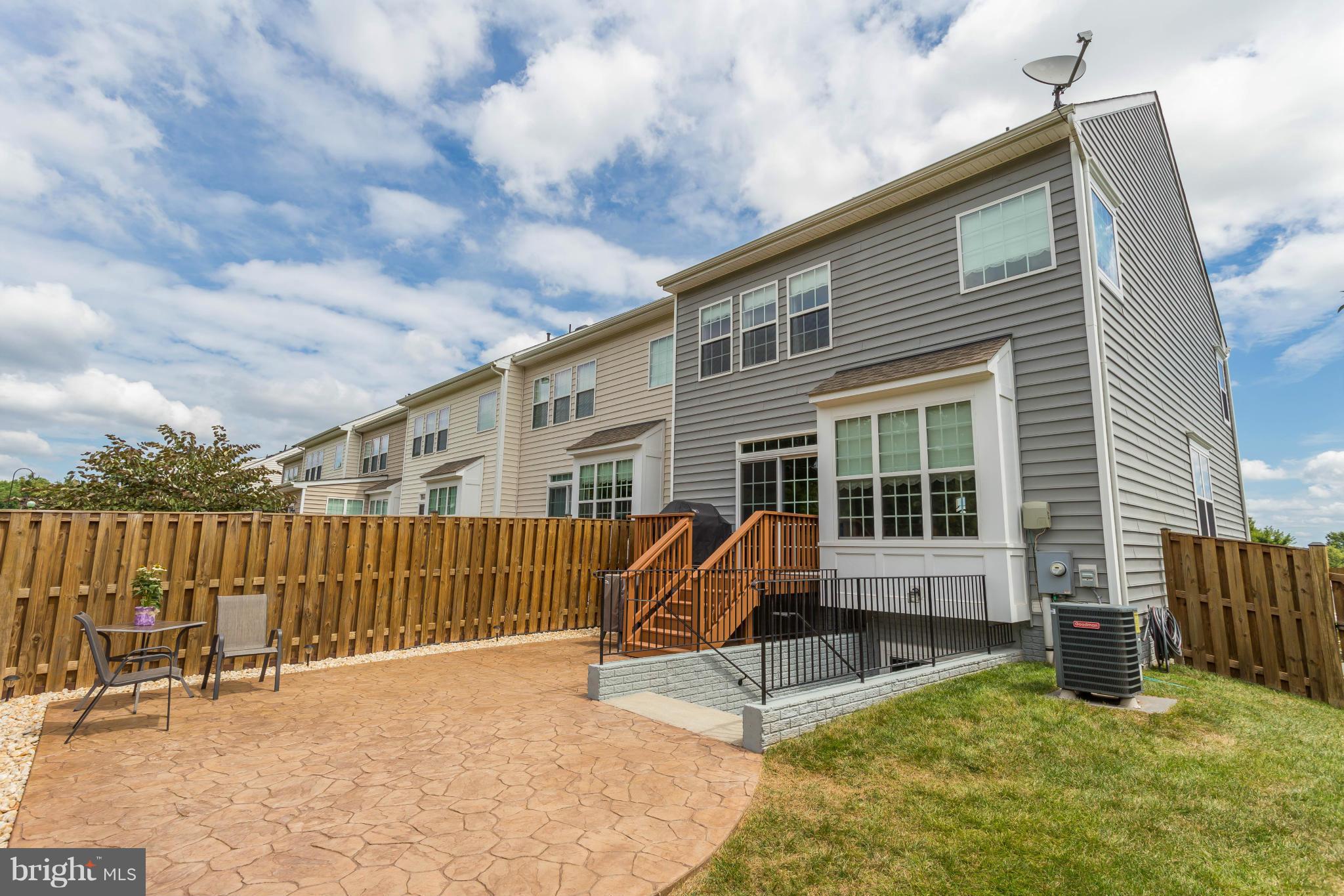 5885 Riverside Drive Woodbridge, VA 22193 - Photo 24 of 24 Stamped Concrete Patio and grass area