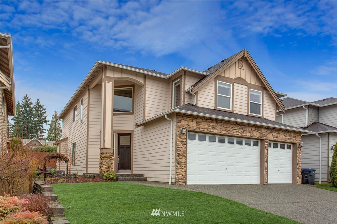 3811 222nd Place Southeast Bothell, WA 98021 - Photo 1 of 35 a front view of a house with a yard