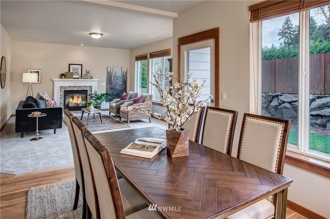 3811 222nd Place Southeast Bothell, WA 98021 - Photo 12 of 35 a view of a dining room with furniture window and wooden floor