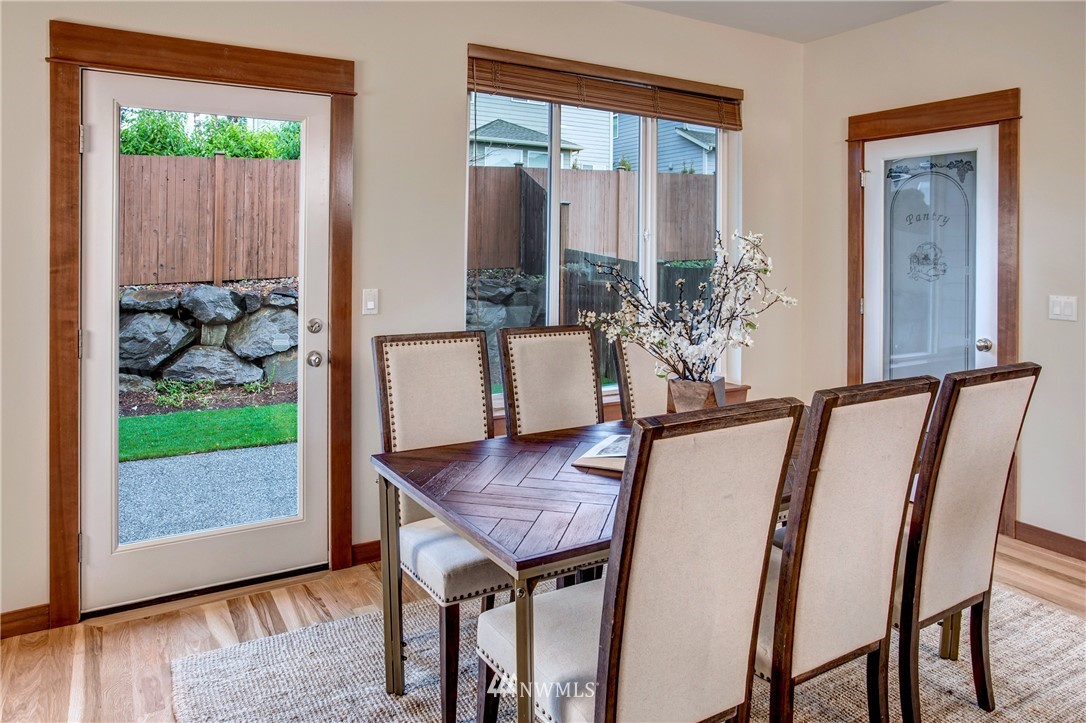 3811 222nd Place Southeast Bothell, WA 98021 - Photo 13 of 35 a view of a dining room with furniture and wooden floor