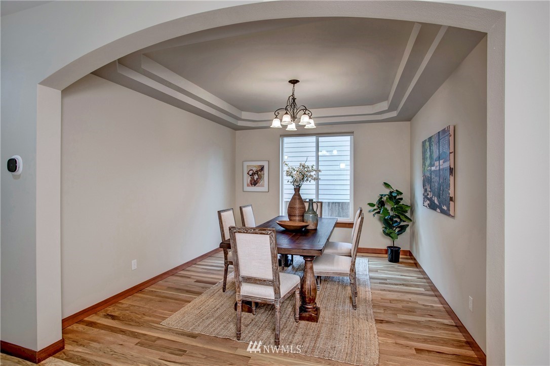 3811 222nd Place Southeast Bothell, WA 98021 - Photo 15 of 35 a view of a dining room with furniture and window