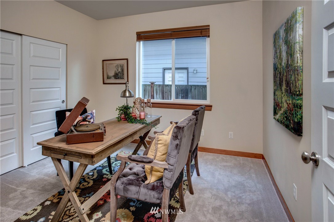 3811 222nd Place Southeast Bothell, WA 98021 - Photo 16 of 35 a view of a dining room with furniture and window