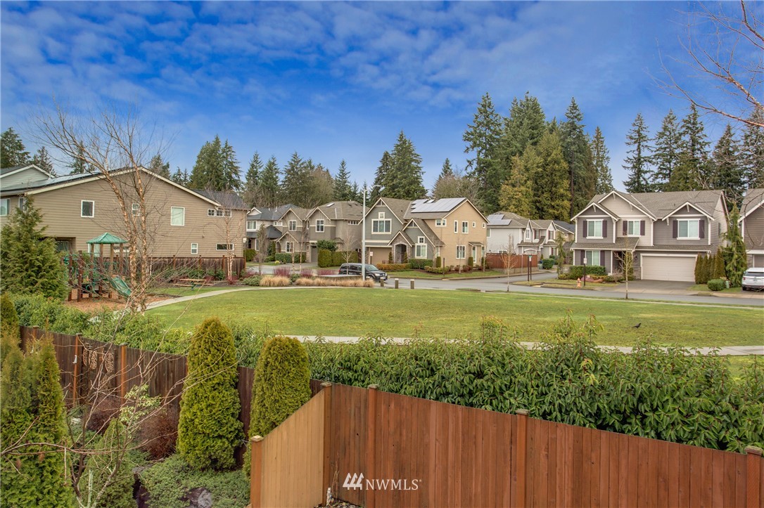 3811 222nd Place Southeast Bothell, WA 98021 - Photo 19 of 35 a view of house with garden and tall trees