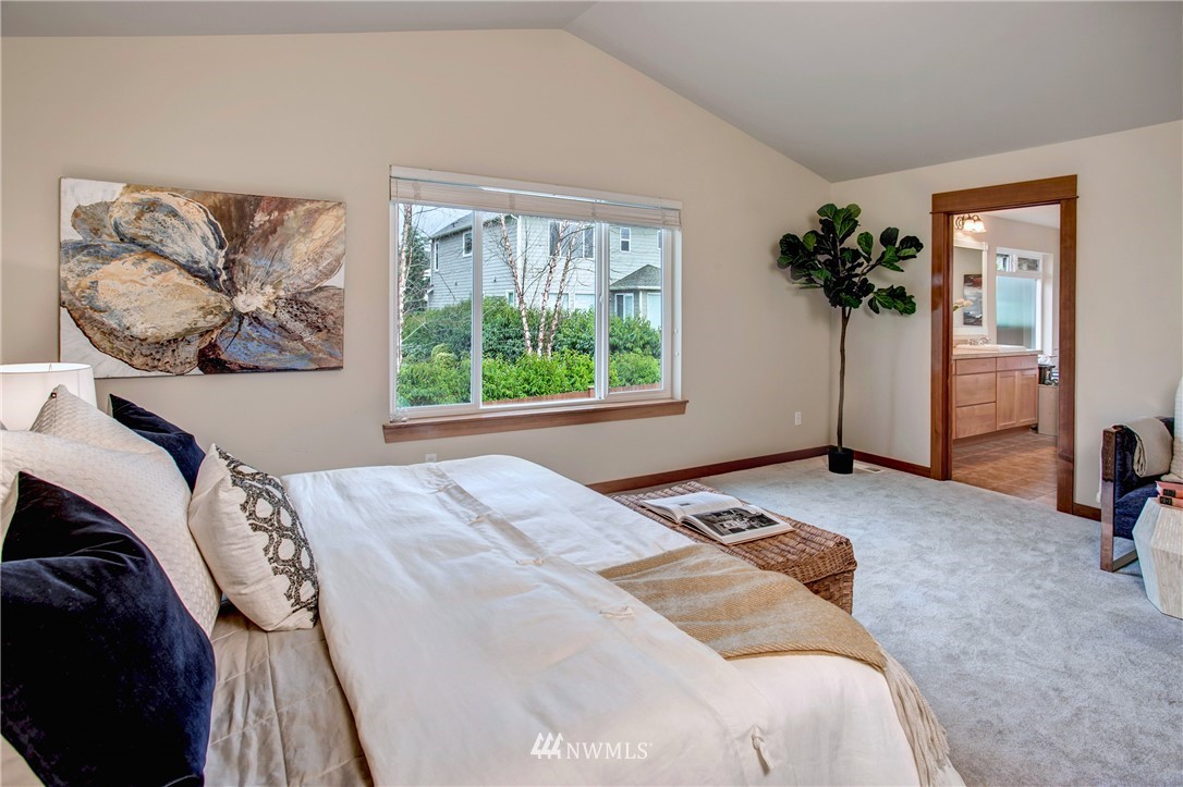3811 222nd Place Southeast Bothell, WA 98021 - Photo 20 of 35 a bedroom with a bed and a painting on the wall