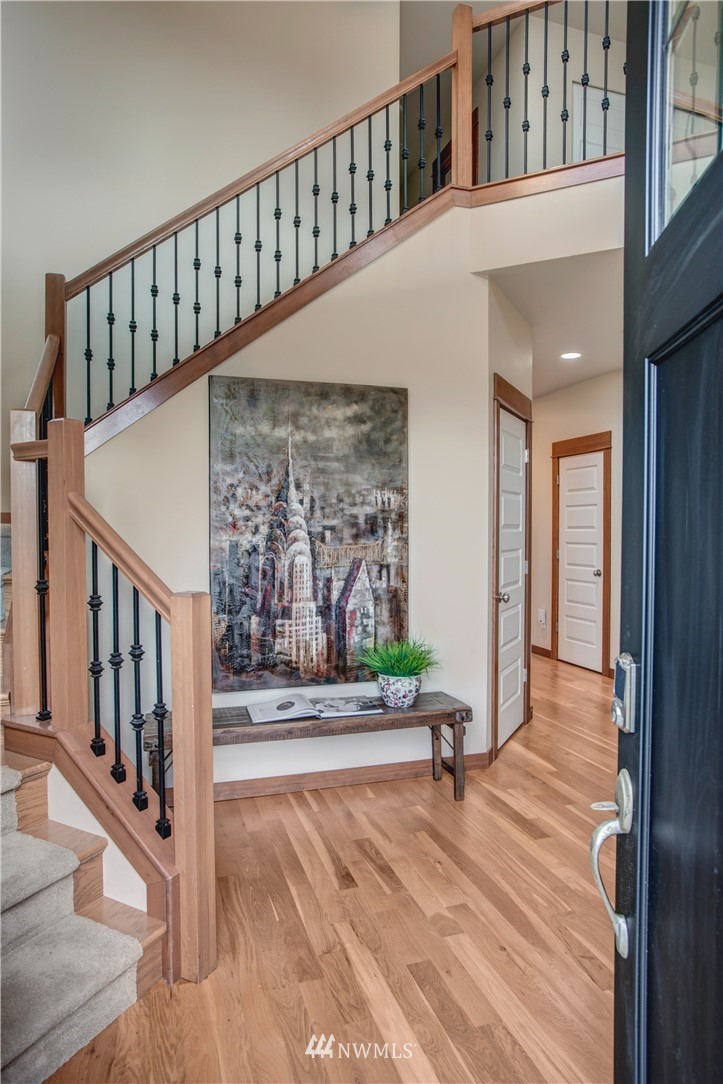 3811 222nd Place Southeast Bothell, WA 98021 - Photo 3 of 35 a view of entryway with wooden floor and windows