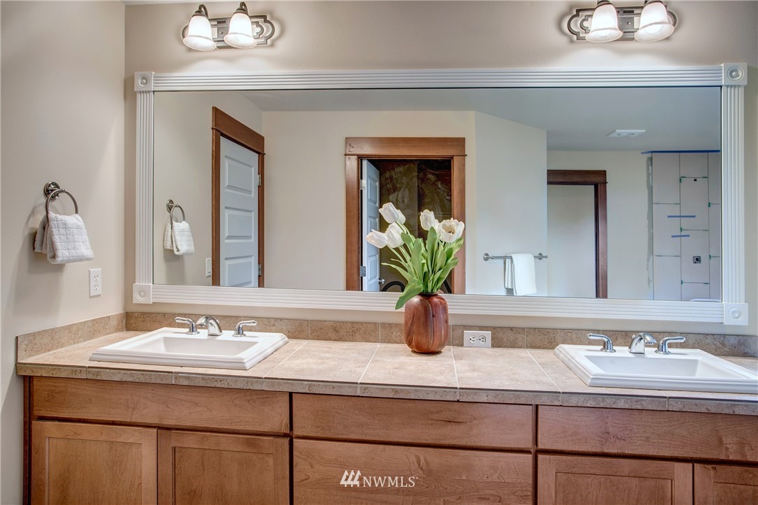 3811 222nd Place Southeast Bothell, WA 98021 - Photo 23 of 35 a bathroom with a sink and a mirror