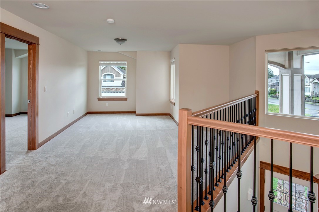 3811 222nd Place Southeast Bothell, WA 98021 - Photo 30 of 35 a view of a hallway with window and stairs