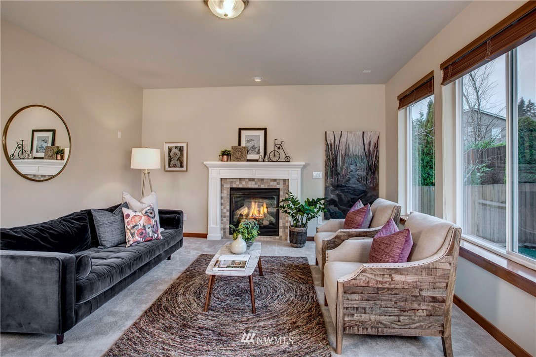 3811 222nd Place Southeast Bothell, WA 98021 - Photo 4 of 35 a living room with furniture and a fireplace