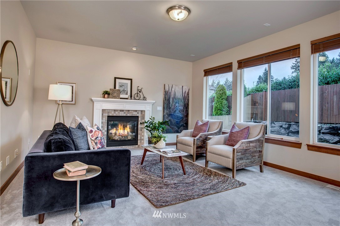 3811 222nd Place Southeast Bothell, WA 98021 - Photo 6 of 35 a living room with furniture and a fireplace