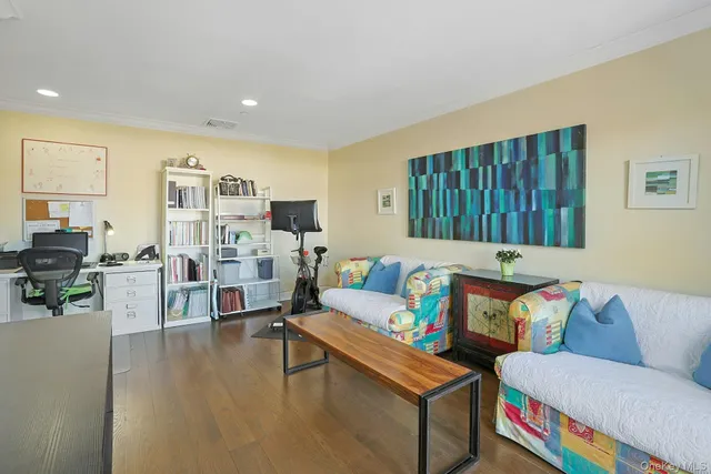 a patio with a table and chairs under an umbrella