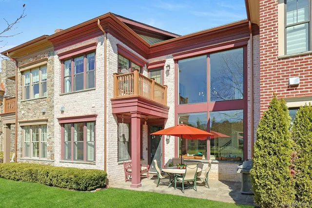 a view of house with backyard outdoor seating and green space