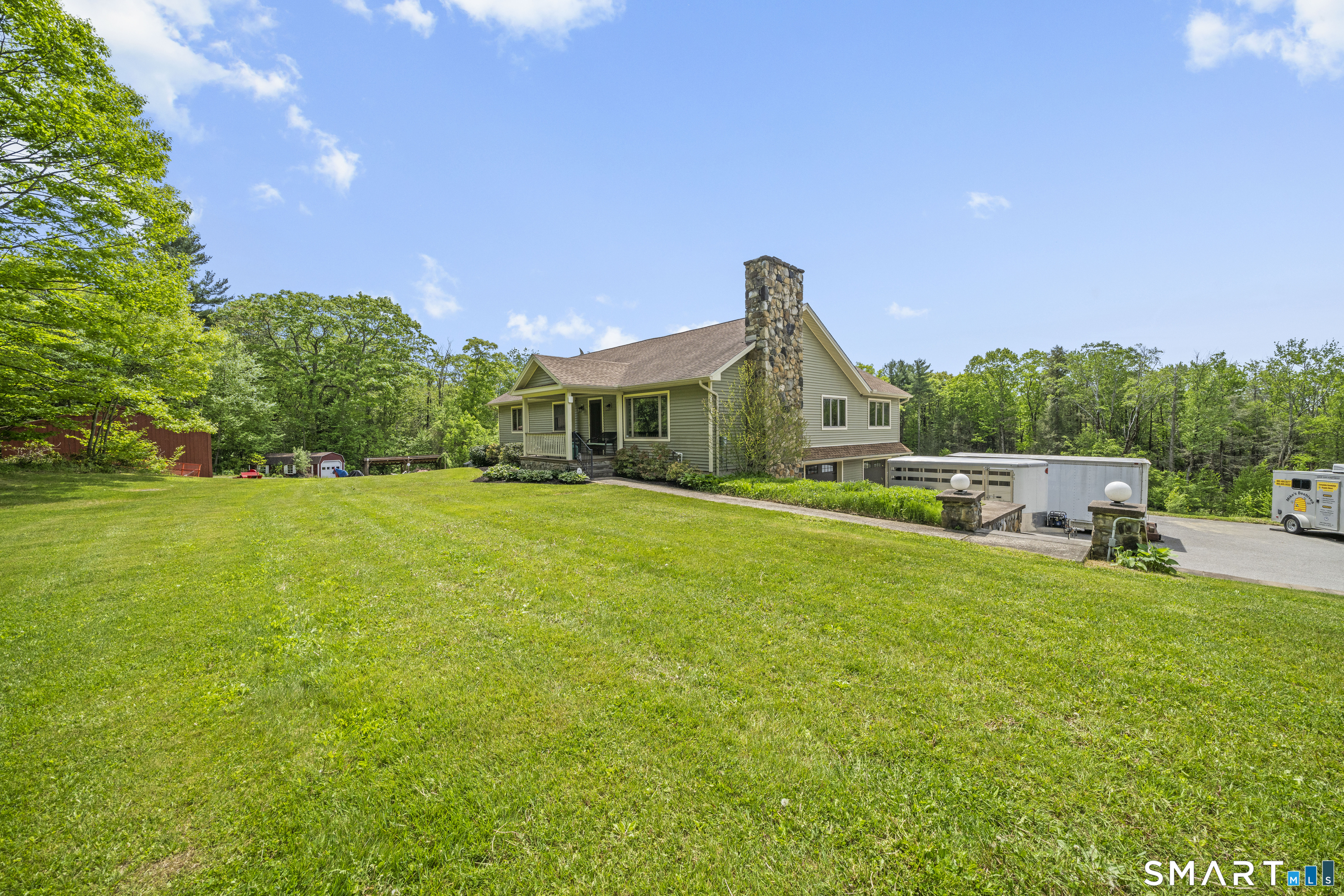 80 Holmes Road Goshen, CT 06756 - Photo 9 of 40 a front view of a house with garden