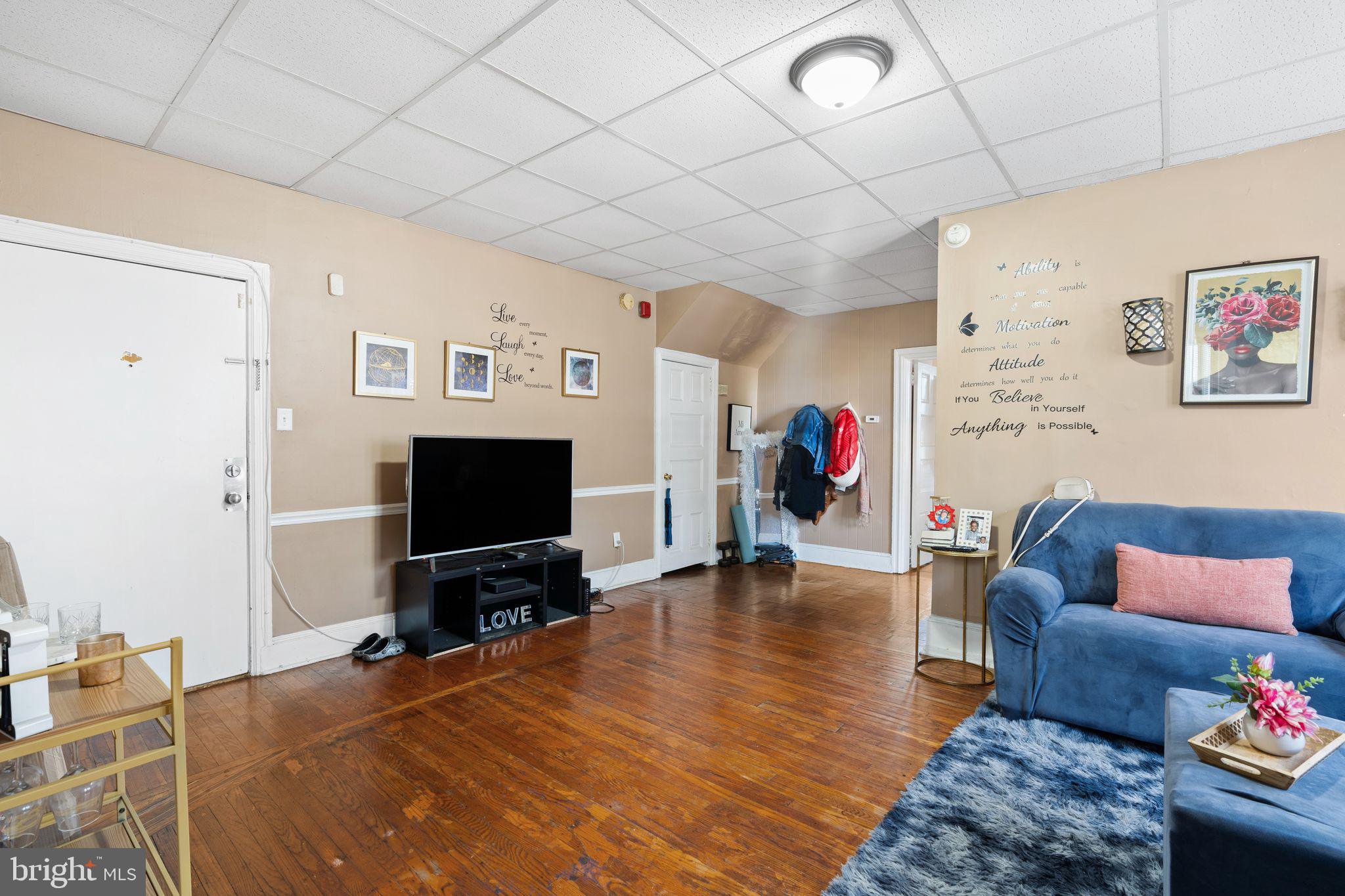 4600 Wayne Avenue Philadelphia, PA 19144 - Photo 14 of 25 a living room with furniture and a flat screen tv