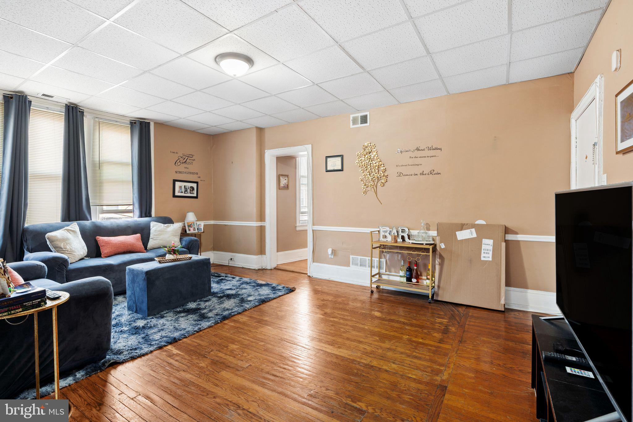 4600 Wayne Avenue Philadelphia, PA 19144 - Photo 15 of 25 a living room with furniture and a flat screen tv