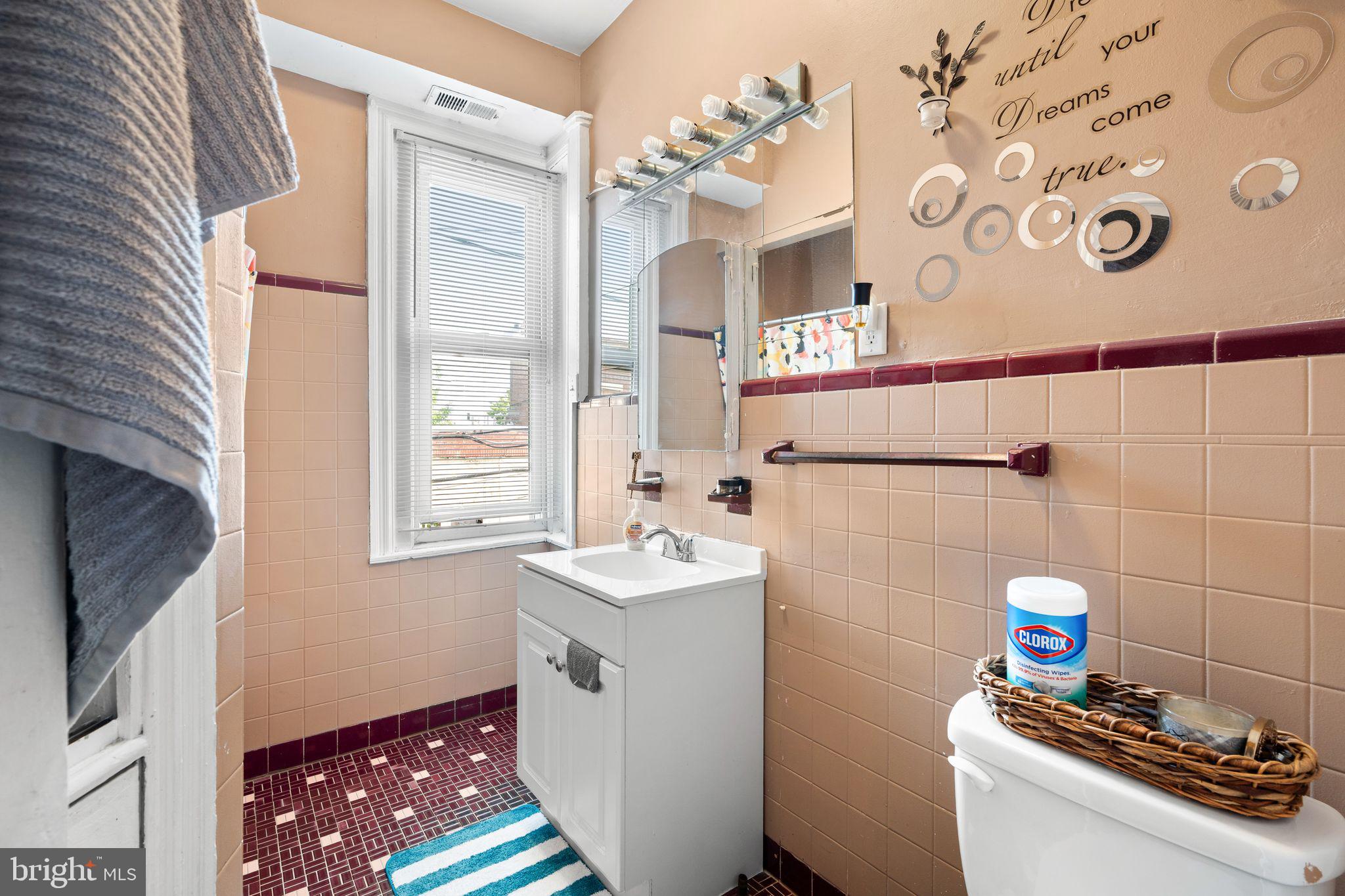4600 Wayne Avenue Philadelphia, PA 19144 - Photo 18 of 25 a bathroom with a sink a mirror and a shower