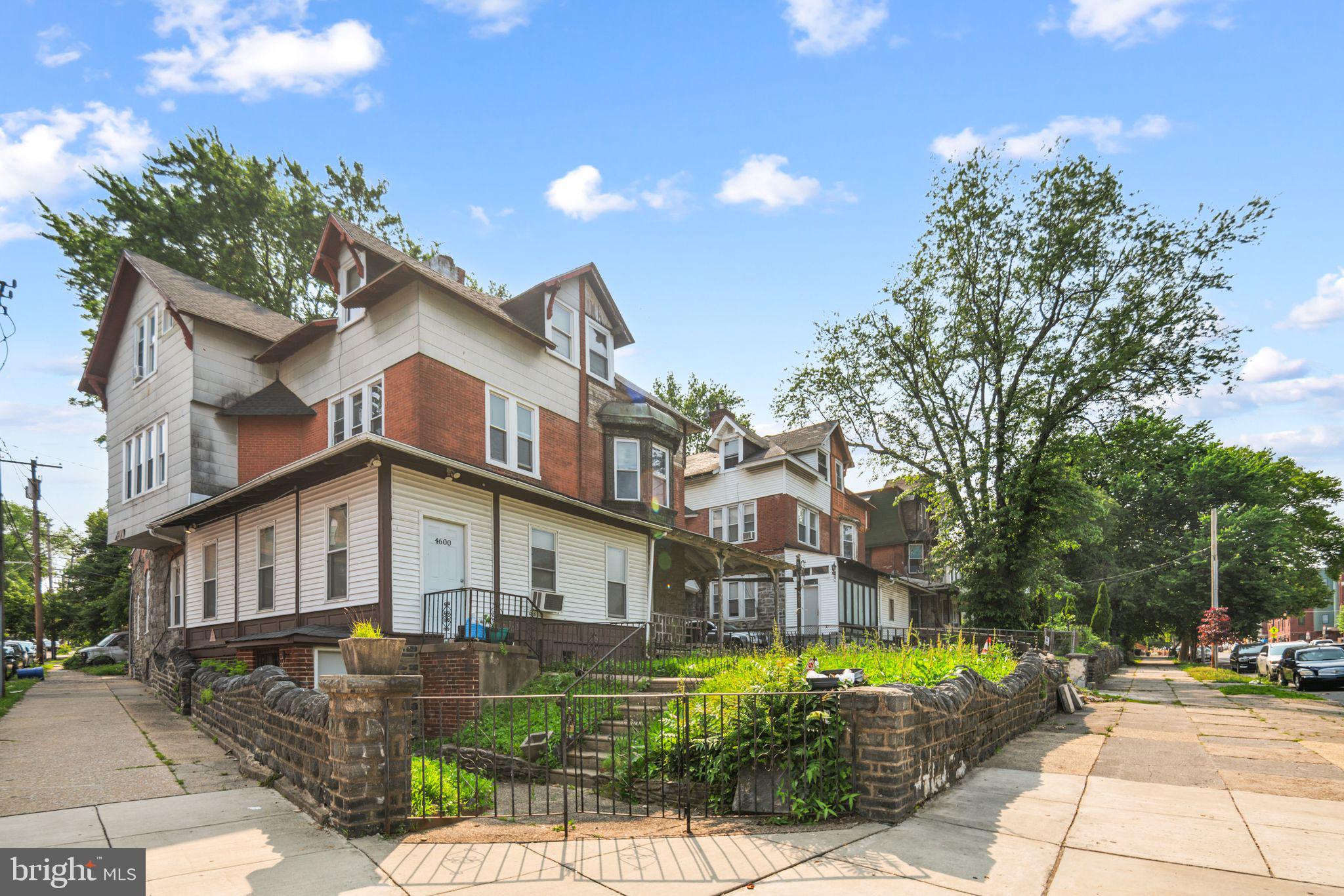 4600 Wayne Avenue Philadelphia, PA 19144 - Photo 2 of 25 a front view of a house with a garden