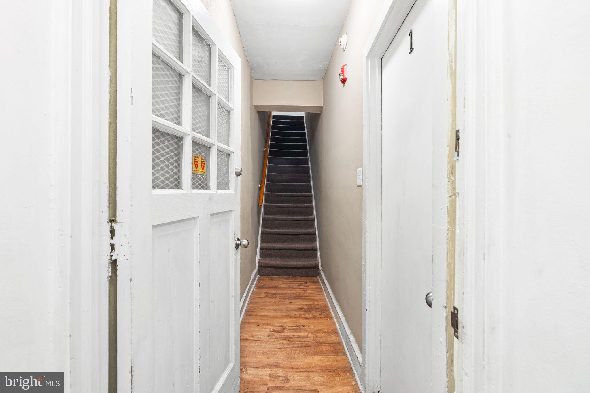 4600 Wayne Avenue Philadelphia, PA 19144 - Photo 4 of 25 a view of a hallway with wooden floor and entryway