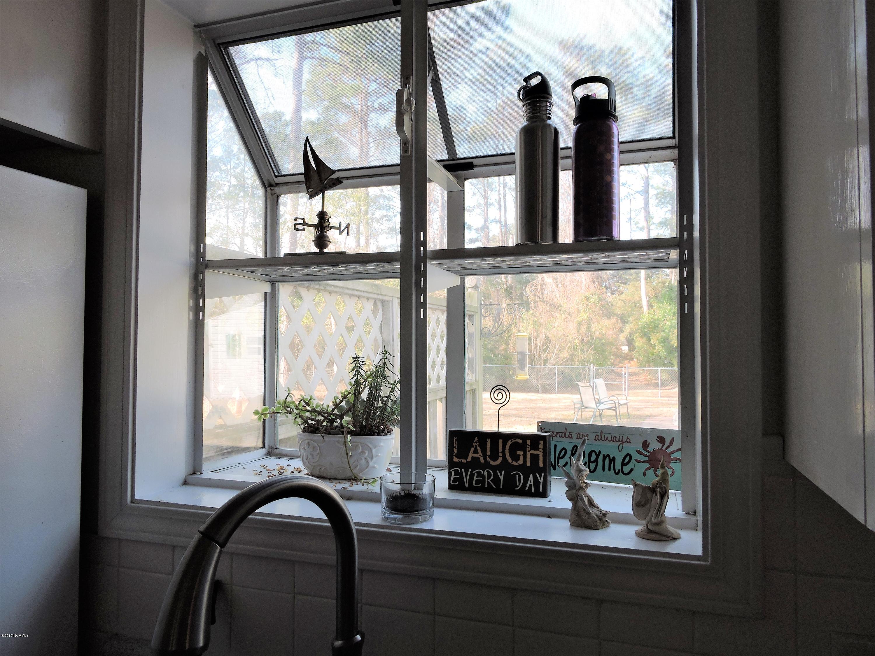 3002 Fairway Road Morehead City, NC 28557 - Photo 12 of 28 Garden window at the kitchen sink overlooking the back yard.