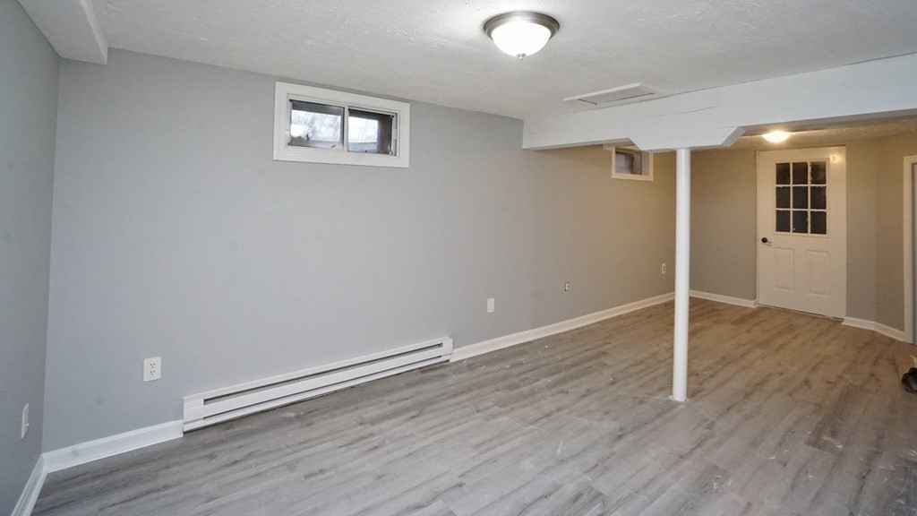 44 Avalon Circle Barnstable, MA 02655 - Photo 13 of 42 an empty room with wooden floor and windows