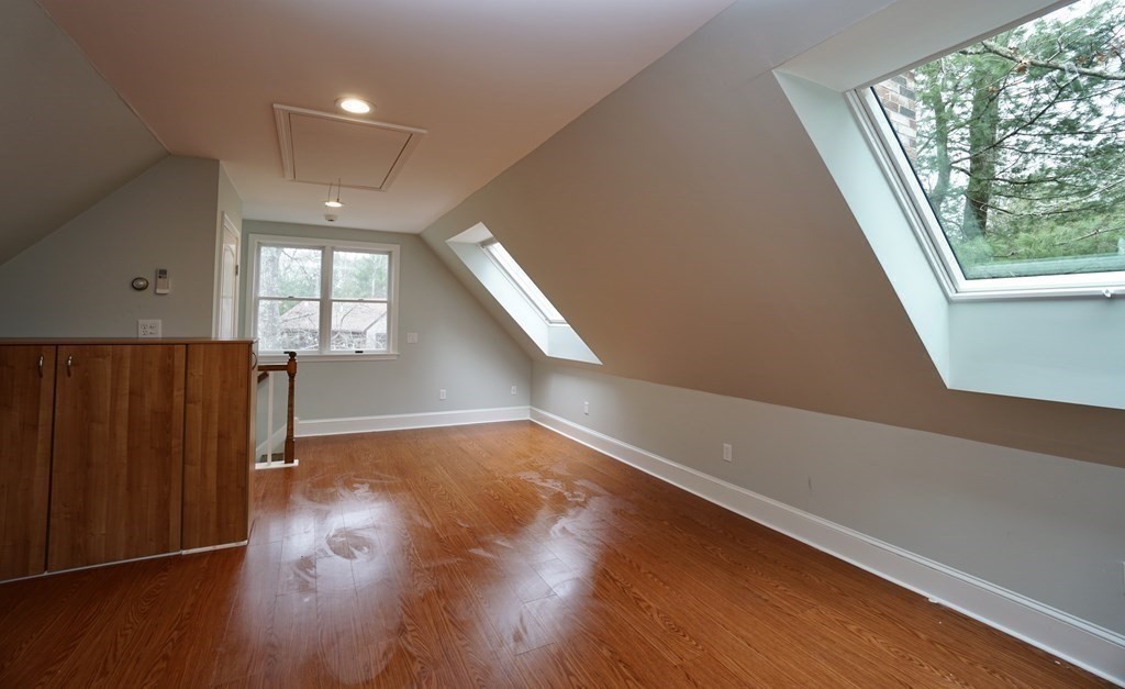 44 Avalon Circle Barnstable, MA 02655 - Photo 16 of 42 an empty room with wooden floor and windows